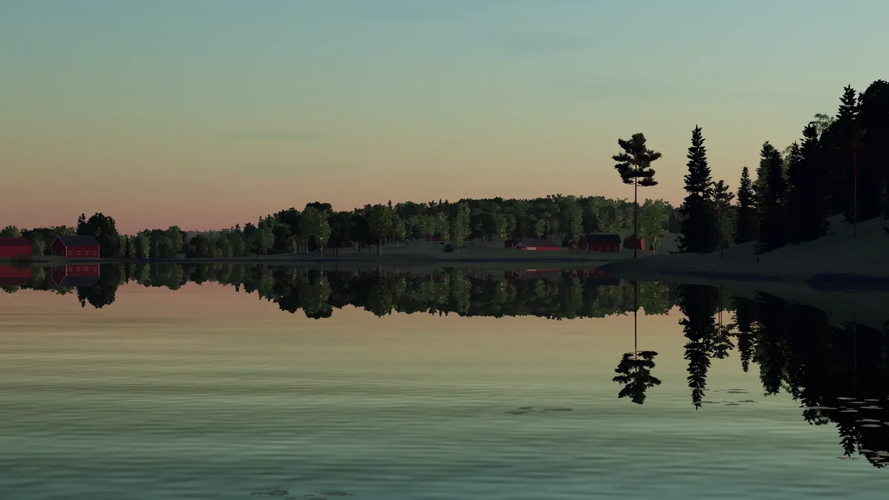 Dawn on the lake: still water, the far shore and its trees mirrored in pink light